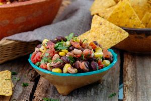 Black Bean Salsa in a colorful bowl with corn tortilla chips
