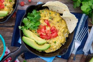 Gluten Free Easy Migas in a cast iron skillet with corn tortilla chips