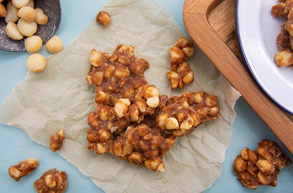 Keto Macadamia Nut Brittle on parchment paper