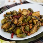 Kung Pao Brussels Sprouts on a white serving dish